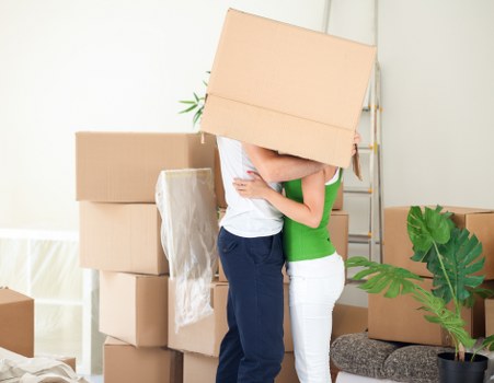 Mover handling boxes carefully during a house removal